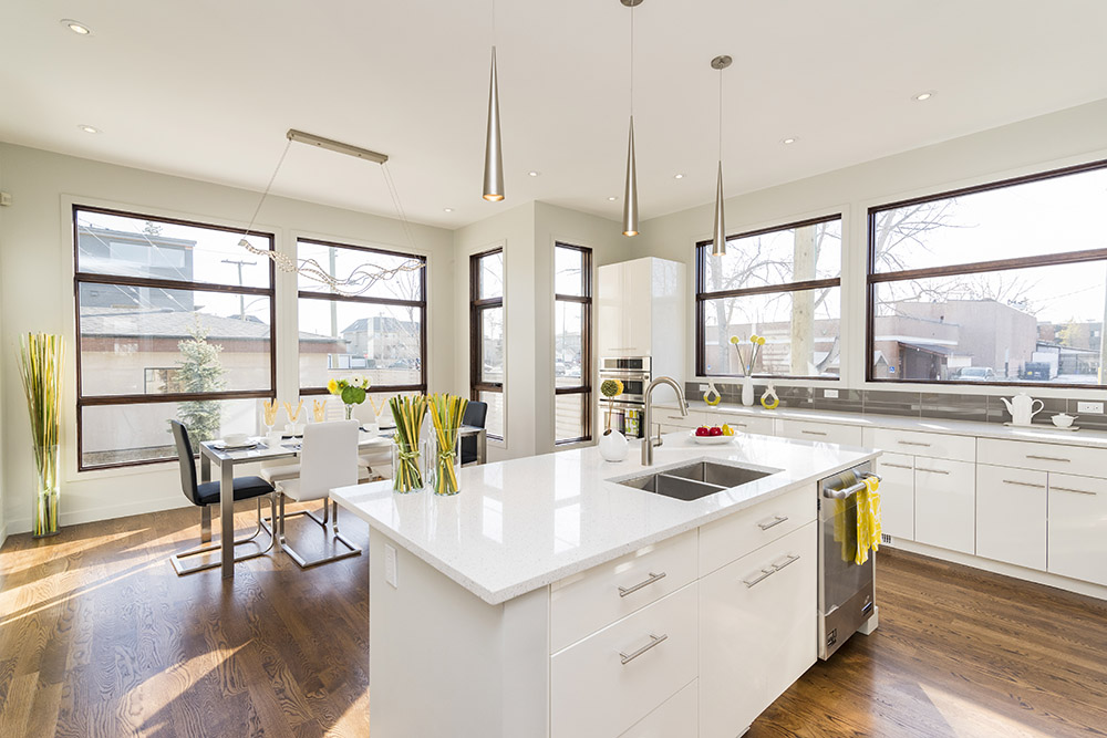 Interior shot of a modern house kitchen with large windows Interior shot of a modern house kitchen with large windows
